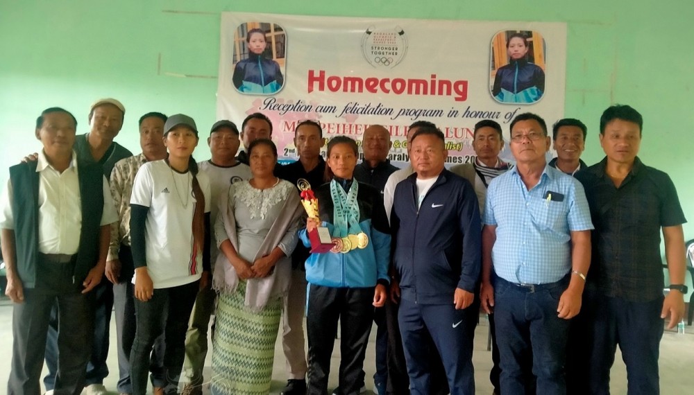 2nd Nagaland Olympic 2022 and Paralympic Best Women Athlete, Peiheiteile Esalung along with the officials of District Sports Council Peren and Tesen Lui Councils, Tesen village during the felicitation programme held at Tesen on August 29. (DIPR Photo)